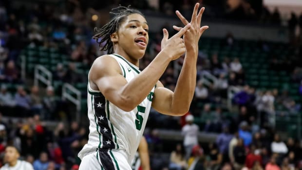 Cass Tech guard Darius Acuff (5) celebrates a play against Muskegon during the second half of the MHSAA boys Division 1 final at Breslin Center in East Lansing on Saturday, March 25, 2023.